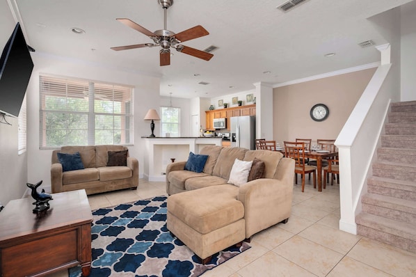 Relax and unwind in our comfortable and inviting living area, perfect for family time after a day of Orlando adventures.