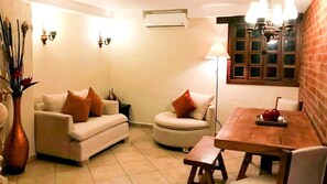 Unique living area with table for six and AC