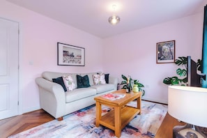 The light and cozy living room makes the perfect place for you to relax in the evening and enjoy the use of the SMART TV.
