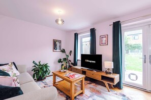 The light and cozy living room makes the perfect place for you to relax in the evening and enjoy the use of the SMART TV.