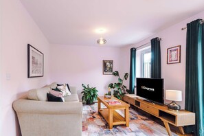 The light and cozy living room makes the perfect place for you to relax in the evening and enjoy the use of the SMART TV.