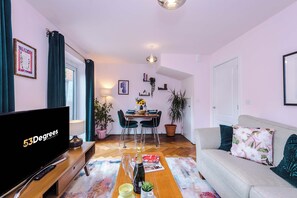 The light and cozy living room makes the perfect place for you to relax in the evening and enjoy the use of the SMART TV.