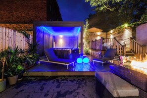 The incredible outdoor space features a gas fire table with plenty of seating, loungers to soak up the good weather and a hot tub with a convertible pergola and custom lighting. You can also connect your phone to the tub for the ultimate vibe.