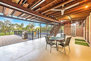 On the lower level of the home, a patio offers further seating and opens out onto the pool and alfresco dining area.