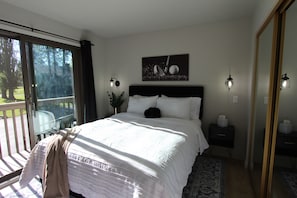 Luxury linens in this comfortable bedroom with balcony &views on the golf course