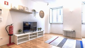 Cozy and modern living space with a smart TV, natural wood floors, and minimalist decor – perfect for winding down after a day exploring Lisbon.
#LisbonApartment #ModernStay #CityEscape #Portugal #PT #Lisbon