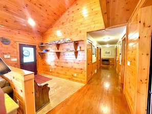 Foyer w/ a bench and hooks for all your vacation gear. Hallway to Main Bed/Baths