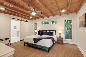 Elegant Master bed room with king bed and desk/TV.