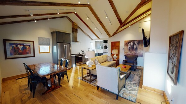 Beautiful high beam ceilings in open concept living area