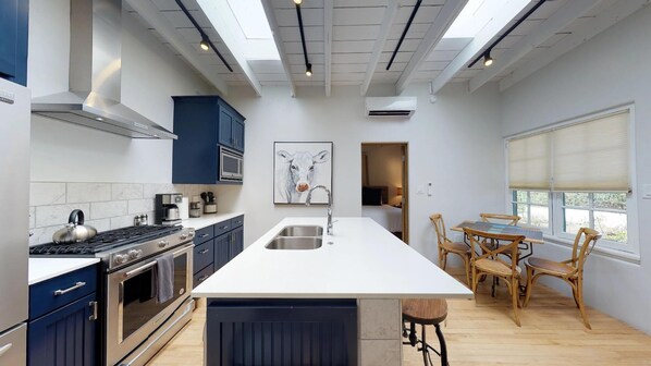 Charming open kitchen with marble countertops