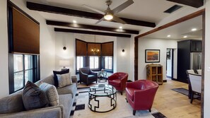 Open living room concept with view into the kitchen and master bedroom