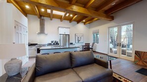 Living room with french doors leading to a private patio