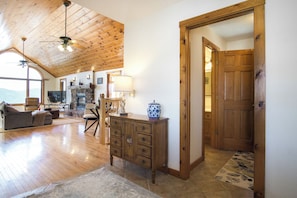 The inviting entrance, framed by natural wood accents and soft outdoor lighting, sets the tone for your stay—peaceful, cozy, and thoughtfully designed.