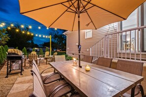 Table with umbrella and citronella candles