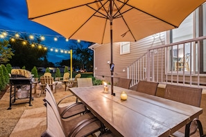 Table with umbrella and citronella candles