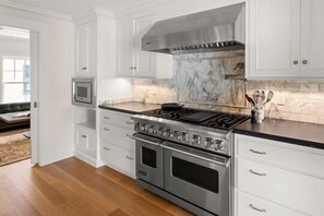 Beautifully renovated kitchen complete with Viking Stove and Marble Backsplash