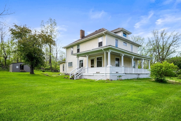 Spacious corner lot with lush greenery and timeless curb appeal—ideal for outdoor entertaining and peaceful retreats.