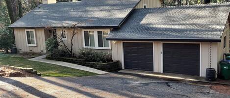 View from street, parking available in front of garage