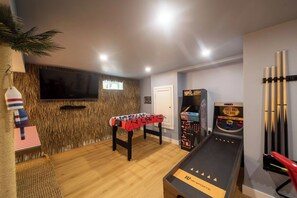 Skee-ball, arcade machine, and foosball.