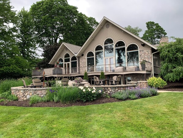 Lake-side/backyard of home , deck, and patio.