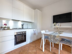 Interior Design, Kitchen, Flooring, Kitchen Appliance, Major Appliance, Wood, Furniture, Countertop, Floor, Cabinetry