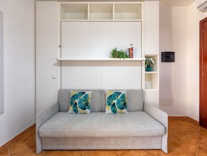 Furniture, Interior Design, Floor, Couch, Flooring, Textile, Room, Living Room, Throw Pillow