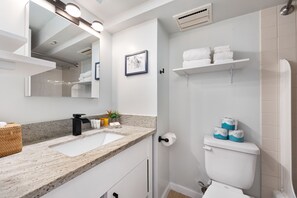 Full bathroom equipped with starter supplies such as shampoo, conditioner, soap, toilet paper, plus a bath towel for each guest!