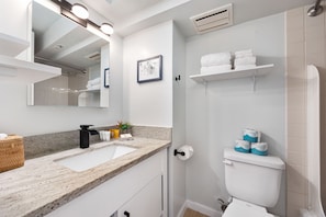 Full bathroom equipped with starter supplies such as shampoo, conditioner, soap, toilet paper, plus a bath towel for each guest!