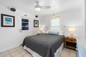 Unit A Bedroom - Queen Bed, Patio Access + TV