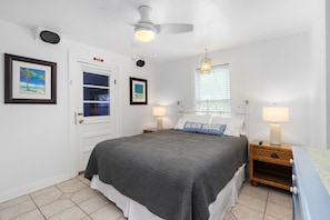 Unit A Bedroom - Queen Bed, Patio Access + TV