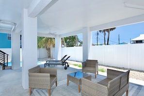 Shaded seating area by pool