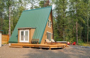 Your cozy A-frame escape awaits! Relax on the deck or soak in the hot tub surrounded by nature. Book your unique getaway now!