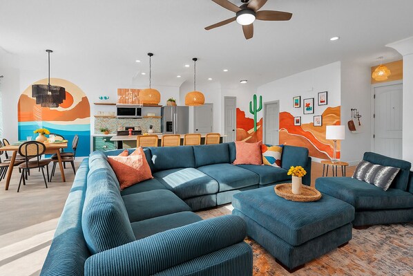 Open floor plan - spacious living room with 75" TV