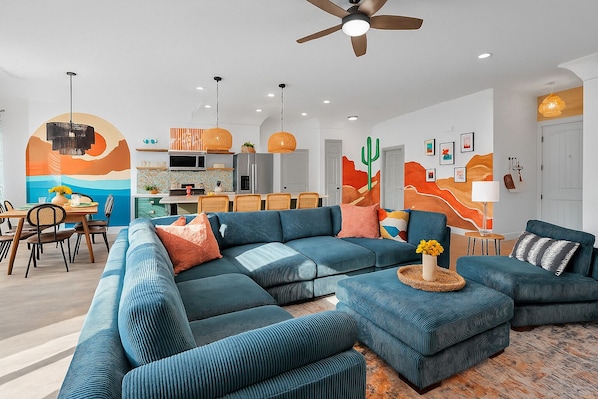 Open floor plan - spacious living room with 75" TV