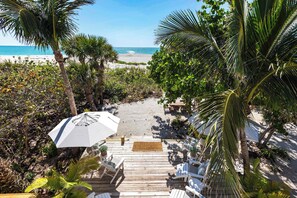 Your own private beach—best enjoyed barefoot in the sand, a cool drink in hand, and nothing but the sound of gentle waves around you