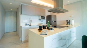 The kitchen is fully equipped with modern appliances and all the utensils and cookware you’d need