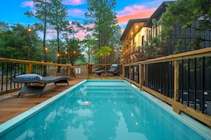 The pool includes a deeper area for swimming as well as swim shelf. It is right next to the front steps at In High Spirits