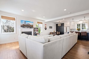 Living area with sectional seating and Smart TV