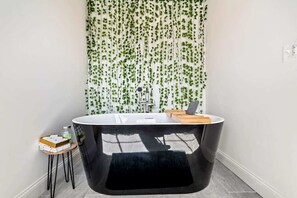 Ensuite bathroom with separate shower and tub 