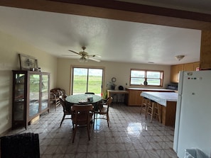 Looking at the dining room/ kitchen from the living room
