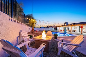 Gather ‘round the firepit under the lights for unforgettable desert nights.