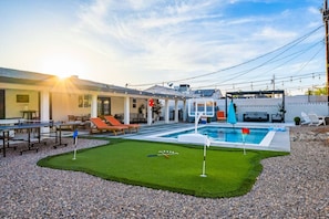 Enjoy a mini golf green, loungers, and poolside bliss.