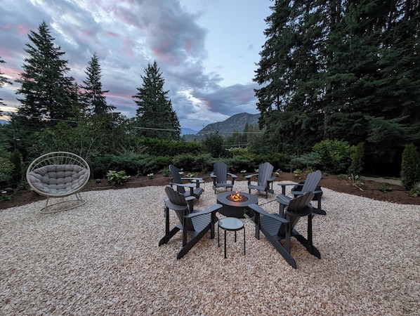 Front Yard with new landscaping, fire pit and Adirondack chairs