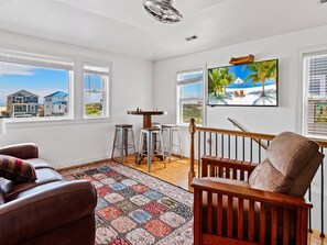 The Top-Level Den is perfect for watching TV and playing chess as day turns into night.