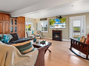 The Living Area is perfect for relaxing after a long day at the beach with a large flat-screen TV and plenty of cozy furniture.