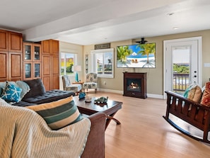 The Living Area is perfect for relaxing after a long day at the beach with a large flat-screen TV and plenty of cozy furniture.