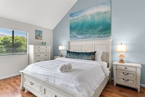 Rest easy in the spacious primary suite with a plush king bed and serene ambiance.