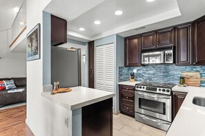 Cook with ease in the fully equipped kitchen featuring all the essentials for a comfortable stay.