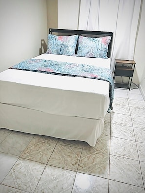 The 2nd BDRM offers a comfortable double bed with cozy linens, ideal for comfort