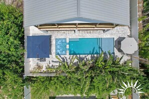 Crystal blue pool and jacuzzi